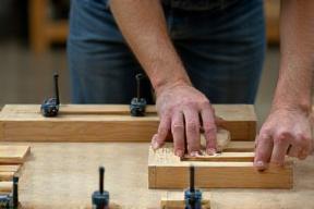Craftsman assembling kitchen cabinets